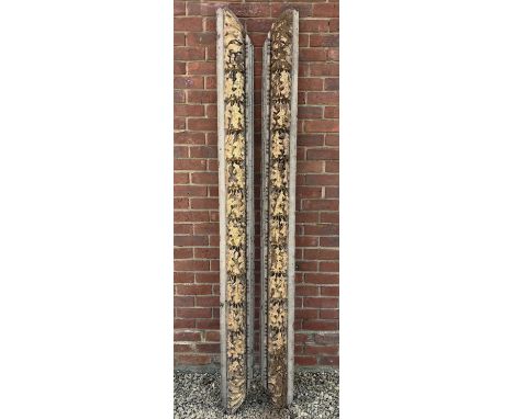 A pair of possibly 18th century carved gilt and painted architectural moulded elements, the deeply carved acorn and oak leaf 