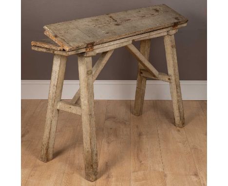 A pine saddle horse for Clarke &amp; Sons, Saddlers of Market Harborough, of hinged construction unfolding into a three-panel