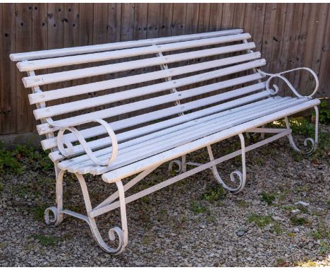 A Victorian white painted garden bench with wrought iron ends213.5cm wide x 83cm highQty: 1Some slats in need of repair. Some
