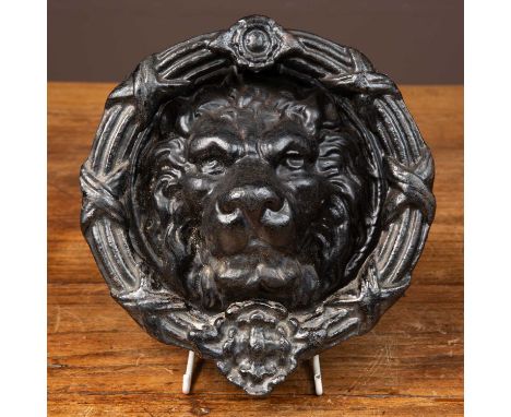 A cast iron door knocker with lion mask and ribbon tied reeded wreath22cm diameterQty: 1sed, with some marks to the paintwork