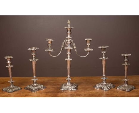 A five-piece Sheffield silver plate garniture set of four candle sticks and a three-stick candelabrumthe candelabrum 54cm hig