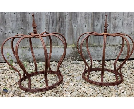 A pair of metal crown finials with arrow tops48cm high x 42.5cm wide x 31cm diameter at the basaeQty: 2Weathered and oxidised