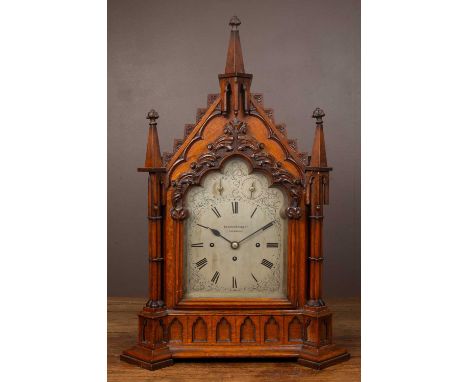 A substantial 19th century oak Gothic style bracket clock by Elkington &amp; Co, Liverpool, the case with arching top, conica