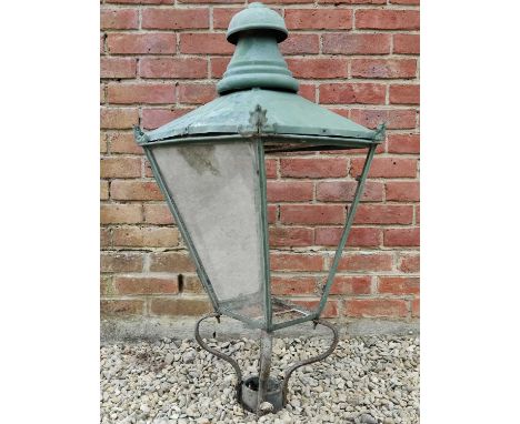 An old green painted copper street lantern on a wrought iron base43cm diameter (at its widest point) x 102cm high Qty: 1In ne