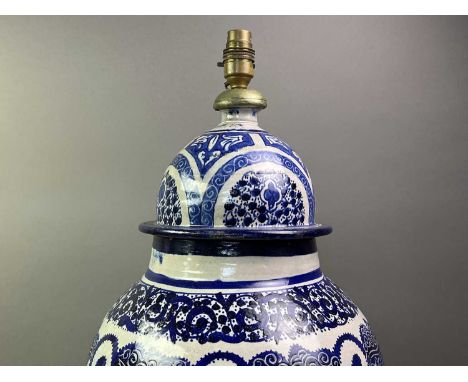 EASTERN BLUE AND WHITE VASE LAMP ALONG WITH ANOTHER the first in urn form, the other crackleglaze69cm highQty: 2Condition gen