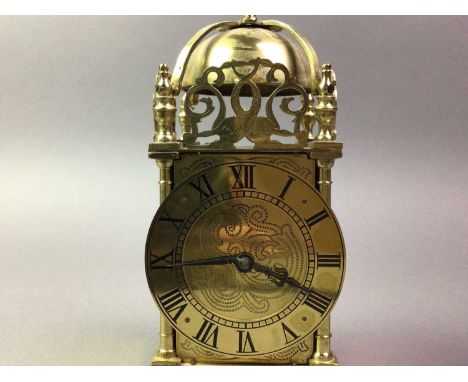 FRENCH BRASS LANTERN STYLE CLOCK the circular dial with Roman numerals 