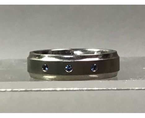 BLUE DIAMOND AND TITANIUM RING the band set with three blue diamonds
