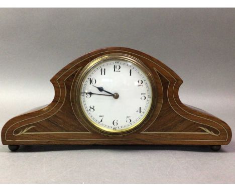 SMALL EDWARDIAN MANTEL CLOCK the circular white enamel dial with Arabic numerals, contained in a mahogany case13cm high