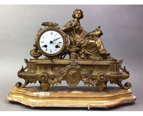 FRENCH FIGURAL MANTEL CLOCK LATE 19TH CENTURY  in gilt spelter, the white enamel dial with Roman numerals, mounted with an al