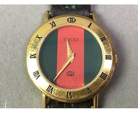 COLLECTION OF FASHION WATCHES ALONG WITH A COMPACT AND A CARVED NUT NECKLACE the watches including Seiko and Gucci, along wit