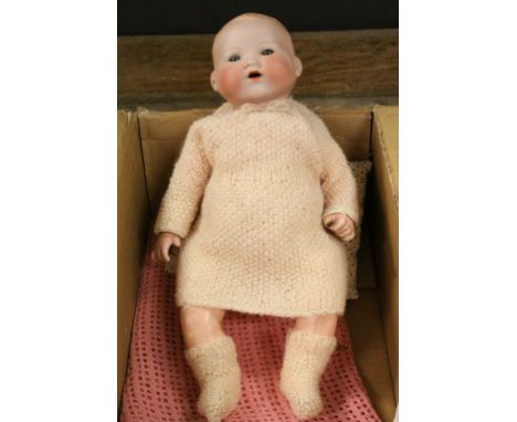 Bisque headed Armand Marseille doll, No.351/51 together with blanket stand and later knitted costume 