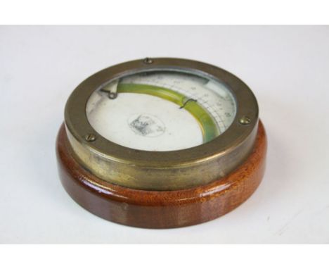 Oak cased circular spirit level possibly maritime decorated with crown coat of arms 