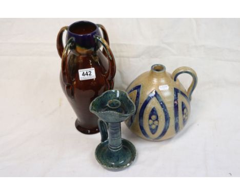 Early 20th Century art pottery vase, a similar chamber stick and a bottle vase with handle 