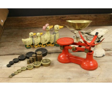 Two sets of vintage weighing scales and weights and a cast iron duck door stop 