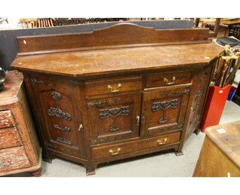 Late 19th century Art Nouveau Oak Sideboard with Three Drawers and Four Cupboards, each with a panel door carved with Art Nou
