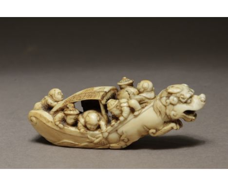 An early 19th century Japanese netsuke form Meiji period. Signed Komin on the base. In carved ivory portrayinf a group of fig