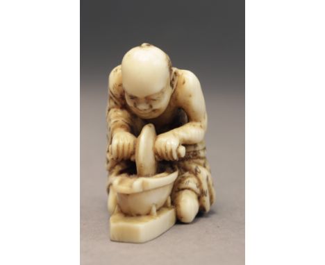 A mid 19th century Japanese netsuke from Edo period. Signed Tomochika on the base. In carved elephant ivory portraying a chem