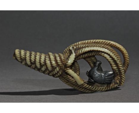 A late 18th century Japanese netsuke from Edo period. Not signed. In carved ivory and silver portraying a coiled cord with a 