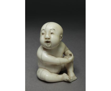 A 19th century Japanese netsuke from Edo period. Signed Tokugyoko on the base. In carved elephant ivory portraying a naked ch