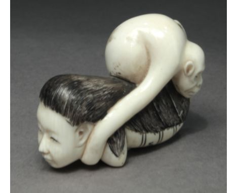 A late 19th century Japanese netsuke from Meiji. Signed on the base. In carved ivory portrying a marine deity bringing a monk