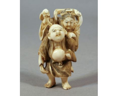 A 19th century Japanese netsuke from Meiji period. Signed HIdezan on the back. In carved elephant ivory portraying Hotei carr