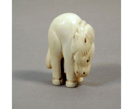 A first third of 20th century Japanese netsuke from Taisho period. Signed on the base. In carved elephant ivory portraying a 