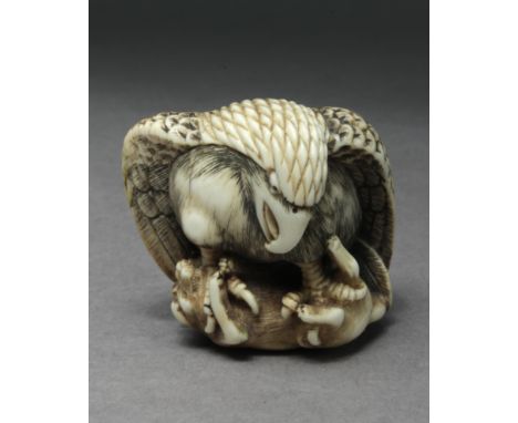 A late 19th century Japanese netsuke from Meiji period. Signed Masahisasai on the base. In carved elephant ivory portraying a