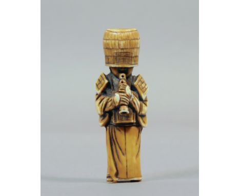 A 19th century Japanese netsuke from Meiji period. Signed on the base. In carved elephant ivory portraying Komuso playing the