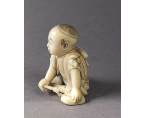 A mid 19th century Japanese netsuke from Edo period. Signed Ryomin on the base. In carved elephant ivory portraying a child s