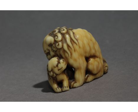 An early 19th century Japanese netsuke from Edo period, Signed Tomochika on the base. In carved elephant ivory portraying a f
