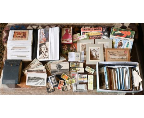 A quantity of vintage and later postcards, cigarette cards and trade-cards (2 boxes)