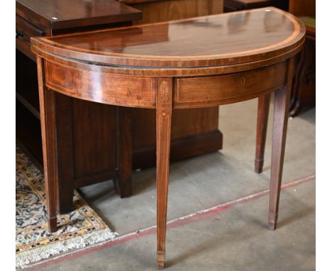 A 19th century mahogany and satin banded demi lune card table with floral marquetry decoration, tapering square legs and spad