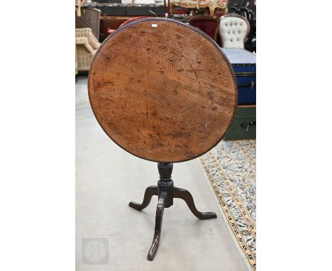 Antique circular oak tilt-top table on tripod base 