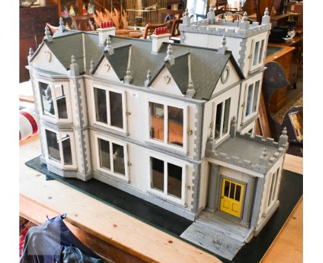 A vintage Scottish grey painted doll's house villa, 123 cm wide at base, to/w a small selection of furnishings