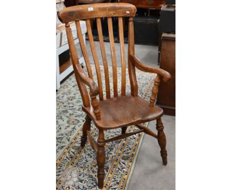 A vintage ash and elm lath back Windsor chair with turned legs and stretchers 