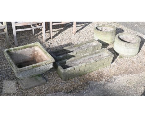 A pair of weathered cast stone trough planters to/w a pair of faux wood cast stone tub planters and a two piece font style pl