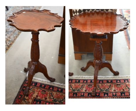 Two similar Georgian style occasional tables in the manner of Chippendale, with scalloped tops and carved tripod bases with l