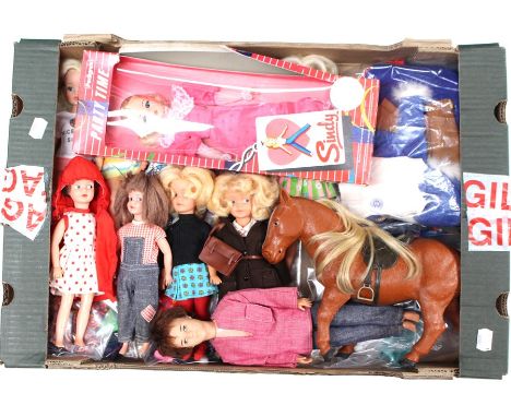 Sindy: A collection of assorted Sindy dolls to include: Sister 'Patch', 'Paul' and horse, together with a quantity of clothes