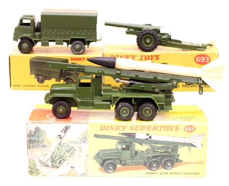 Dinky: A boxed Dinky Toys Honest John Missile Launcher, 665; together with a boxed Dinky Toys, 7.2 Howitzer, 693; and a boxed