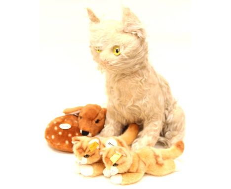 Steiff: A Steiff Deer, '070914'; together with two Steiff cats, '281563'; together with a Farnell Alpha Musical Cat. (4)