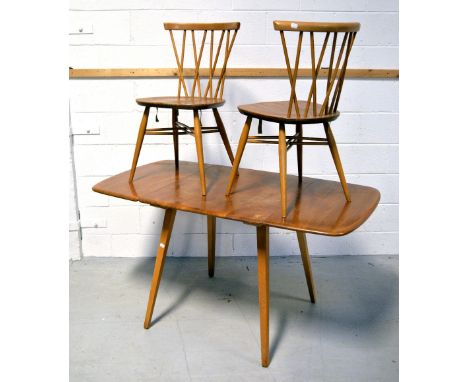 A retro Ercol extending dining table on outstretched square section legs, width when extended 137cm and a pair of stick back 