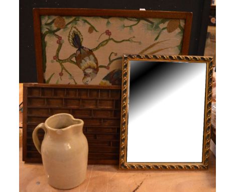 An Edwardian tapestry firescreen, a large stoneware jug (af), a printer's tray and a rectangular gilded mirror (4).