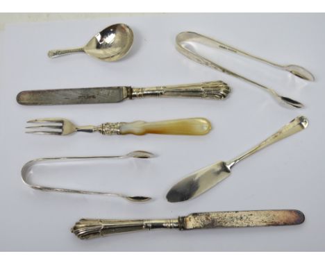 Hallmarked silver flatware to include a George III caddy spoon, an Edward VII pair of sugar tongs, Sheffield 1904, a further 