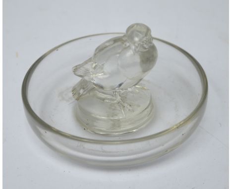 Lalique; a pre-1945 clear glass pin dish centred with a bird and with etched mark to base "R. Lalique', diameter 9cm.   CONDI