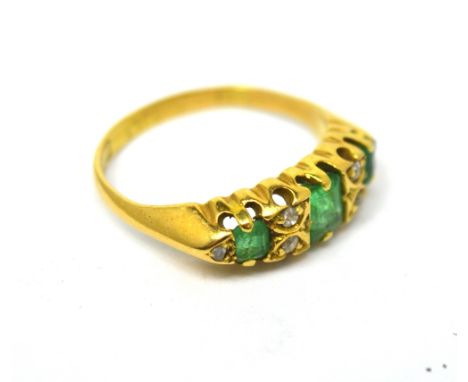 An 18ct yellow gold emerald and diamond ring, size L, approx 3.8g.