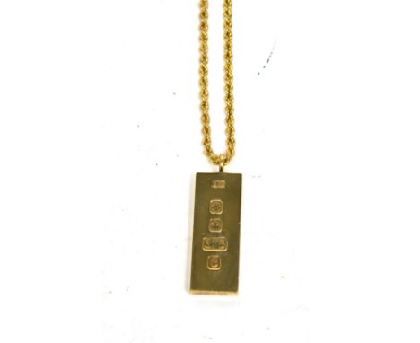 A 9ct yellow gold ingot on a 9ct yellow gold chain, approx 36g.