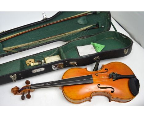 A cased full-size violin with two-piece back, no visible label and two bows, a cased Selmer clarinet, a cased Olympus OM10 ca