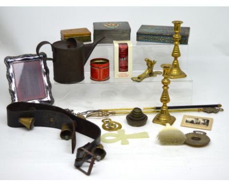 A small collectors' lot to include a vintage oil can, leather strap with cow bells, a small quantity of weights, a brass door