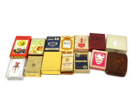 A small collection of vintage playing cards to include a set of Tarot cards.