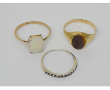 A 9ct yellow gold signet ring and two further 9ct gold dress rings, approx combined 4.8g (3).